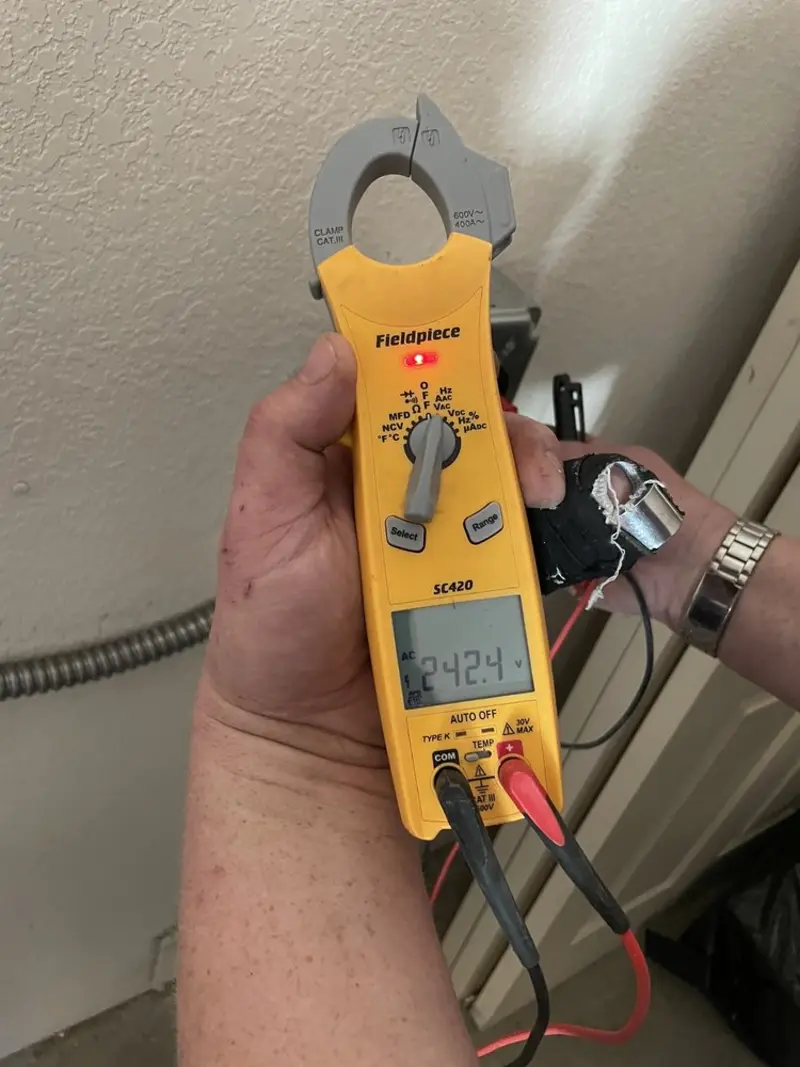 Voltage testing with clamp meter during Recessed Lighting Installation in Baraboo
